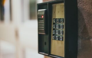 Illuminated security keypad mounted on wall for keyless entry access control