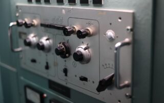 Close-up of switches and dials on an industrial control panel