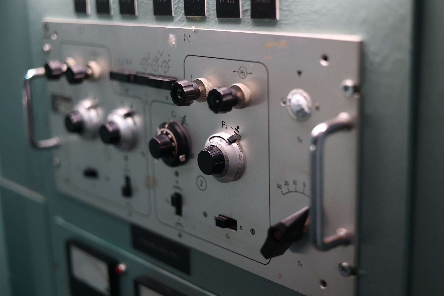 Close-up of switches and dials on an industrial control panel