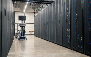 Steel server cabinets with networking devices and cables in a data center