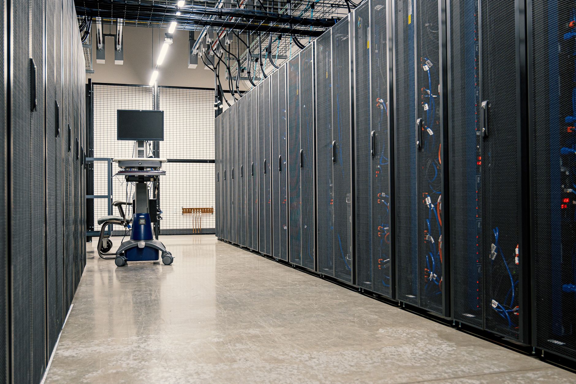 Steel server cabinets with networking devices and cables in a data center