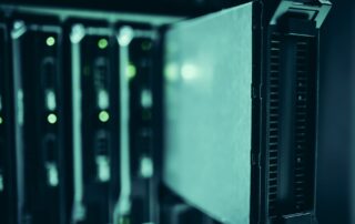 Rows of server racks in a data center facility